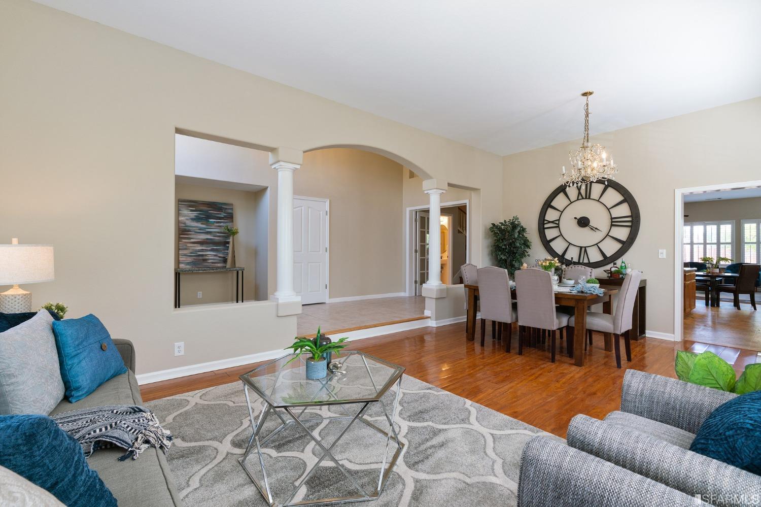 1359 Oak Crest Way Antioch, CA 94531 - Photo 7 of 65 a living room with furniture a clock and a large mirror