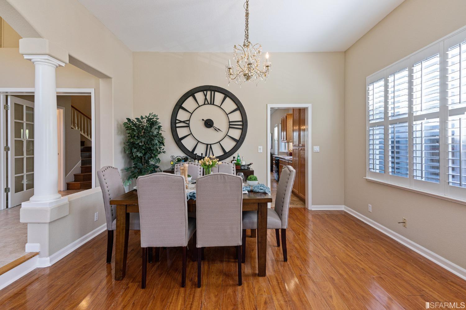 1359 Oak Crest Way Antioch, CA 94531 - Photo 9 of 65 a dining room with furniture a chandelier and wooden floor