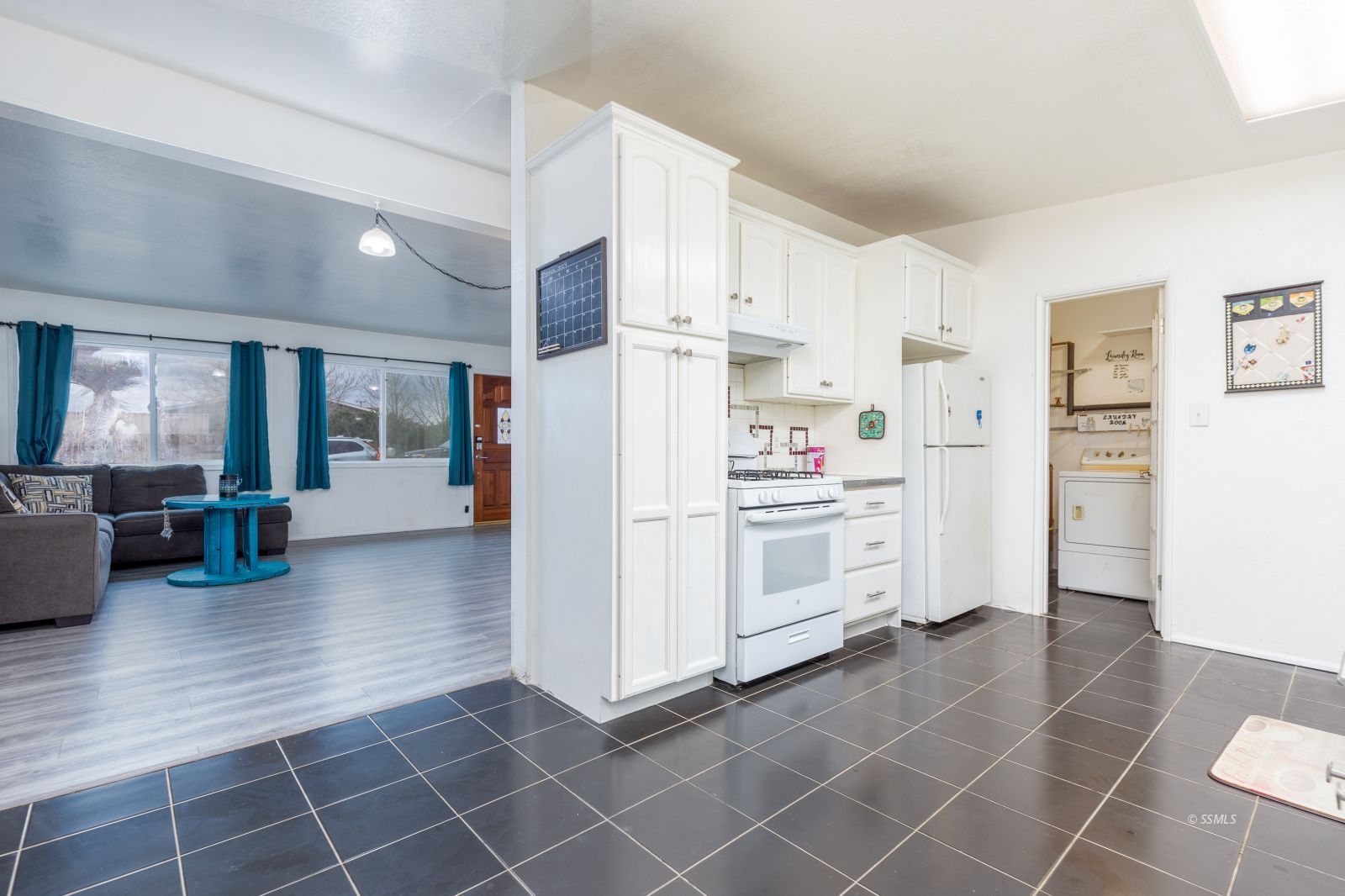 1263 South Primrose Street Ridgecrest, CA 93555 - Photo 10 of 36 a kitchen with white cabinets and white appliances