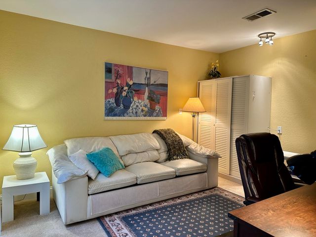 a bathroom with a sink a toilet a mirror and shower