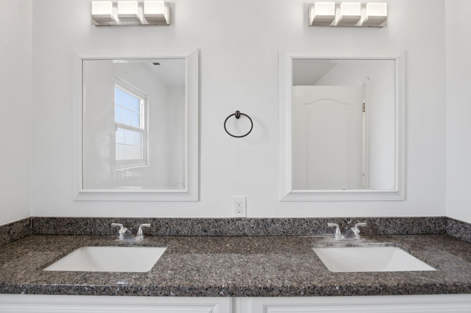 5333 Geer Road Turlock, CA 95382 - Photo 16 of 37 a bathroom with a granite countertop sink and a mirror