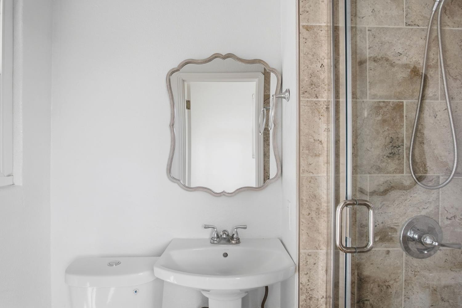 5333 Geer Road Turlock, CA 95382 - Photo 20 of 37 a bathroom with a sink and mirror