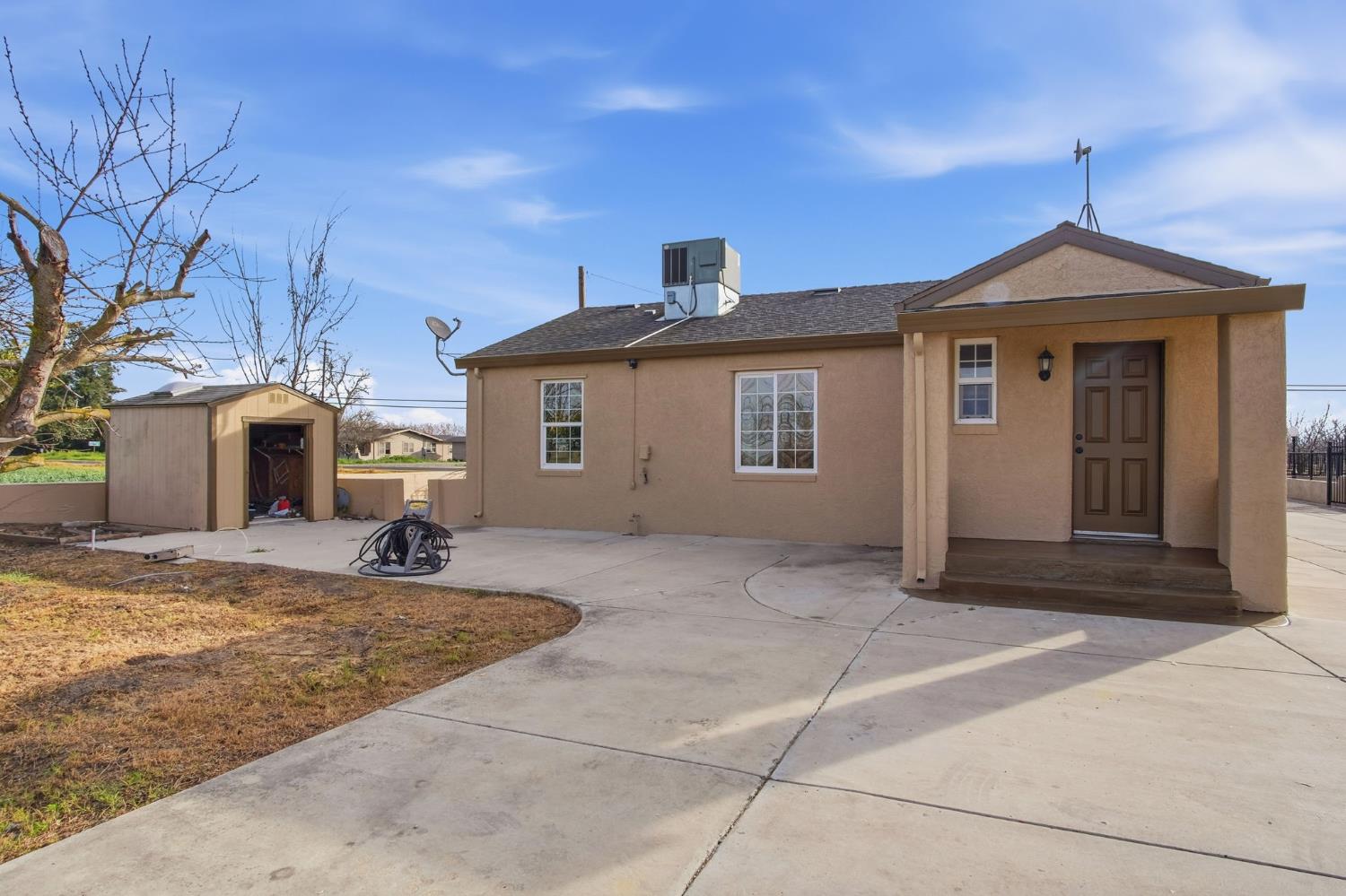 5333 Geer Road Turlock, CA 95382 - Photo 22 of 37 a front view of a house with a yard
