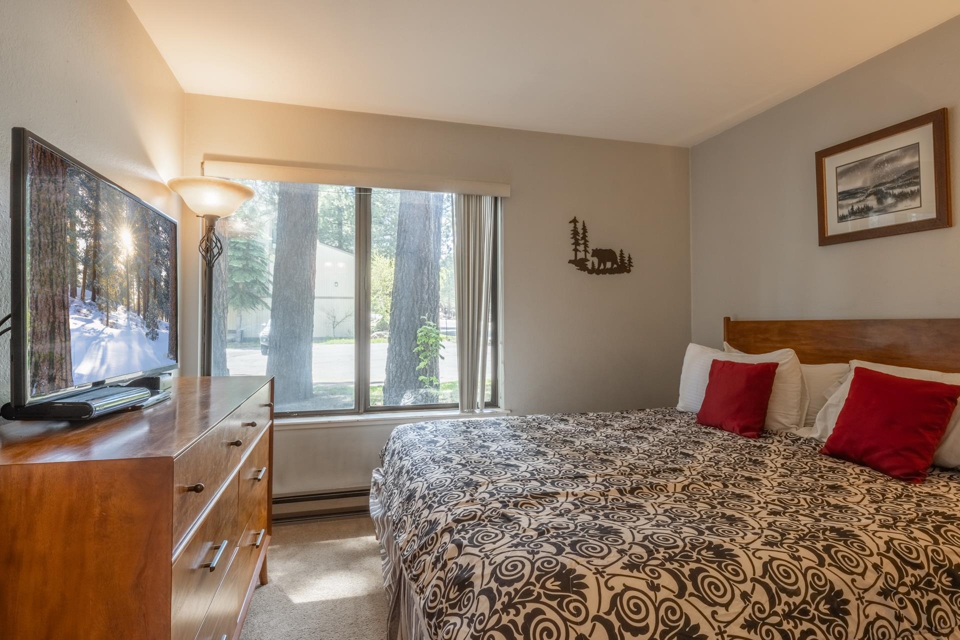 2113 Meridian Boulevard, Unit 141 Mammoth Lakes, CA 93546 - Photo 12 of 23 Bedroom with light colored carpet and a baseboard radiator