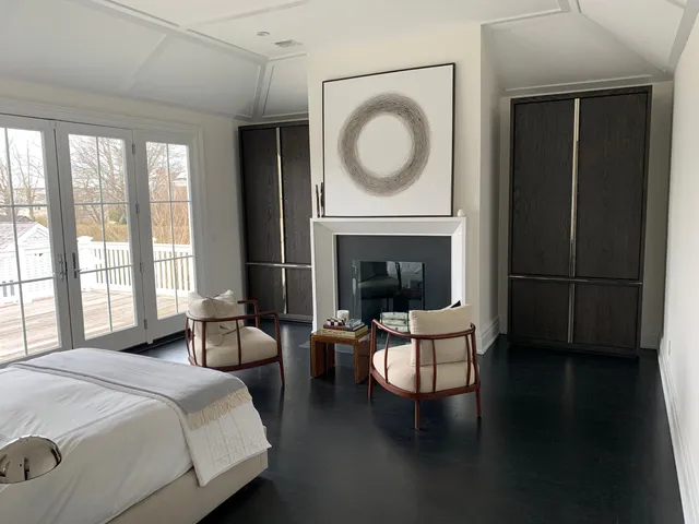 a bathroom with a double vanity sink a toilet and shower
