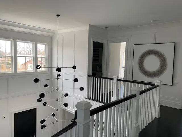 a bedroom with a bed gym equipment and a window