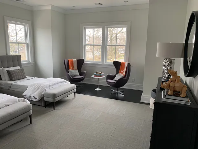 a bedroom with two beds and a window