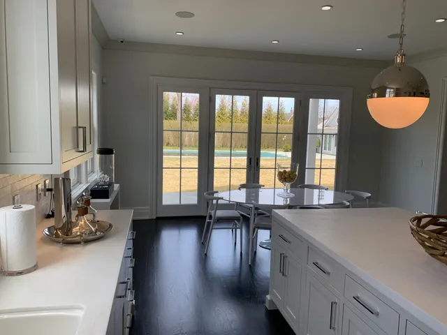 a kitchen with a sink and a large window