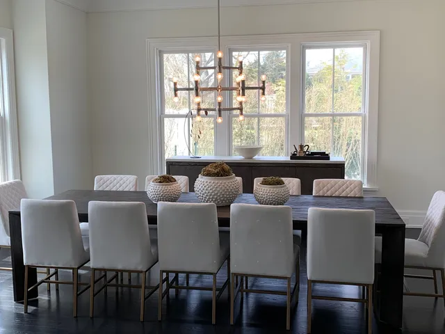 a view of a dining room with furniture and window