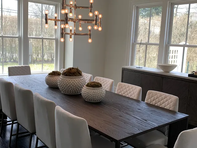 a dining room with furniture and window