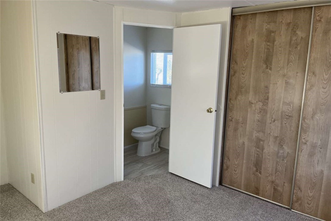 1582 Locust Road Pinon Hills, CA 92372 - Photo 4 of 6 a bathroom with a granite countertop sink and mirror