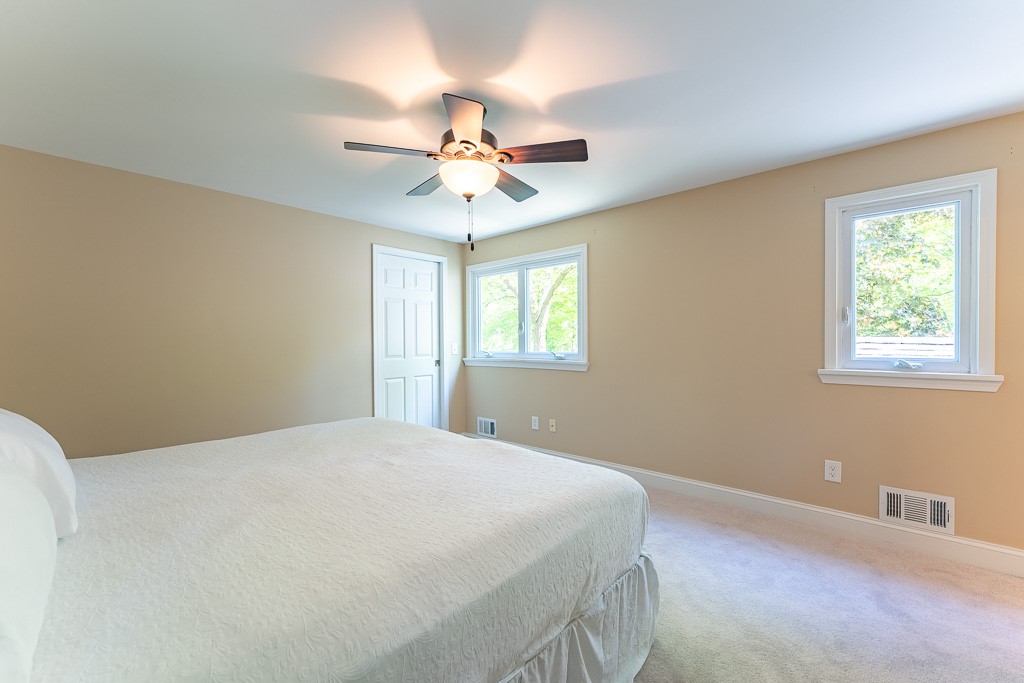 220 Hibiscus Drive Rochester, NY 14618 - Photo 36 of 50 The primary suite, set just above the main bedroom wing, feels like a private sanctuary .