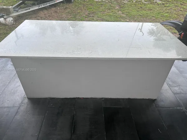 a view of a swimming pool with a chair