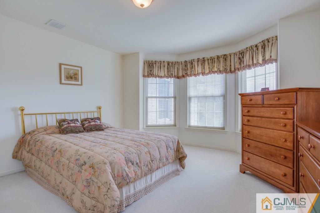 85 Sharon Road Robbinsville, NJ 08691 - Photo 19 of 25 a bedroom with a bed and a window