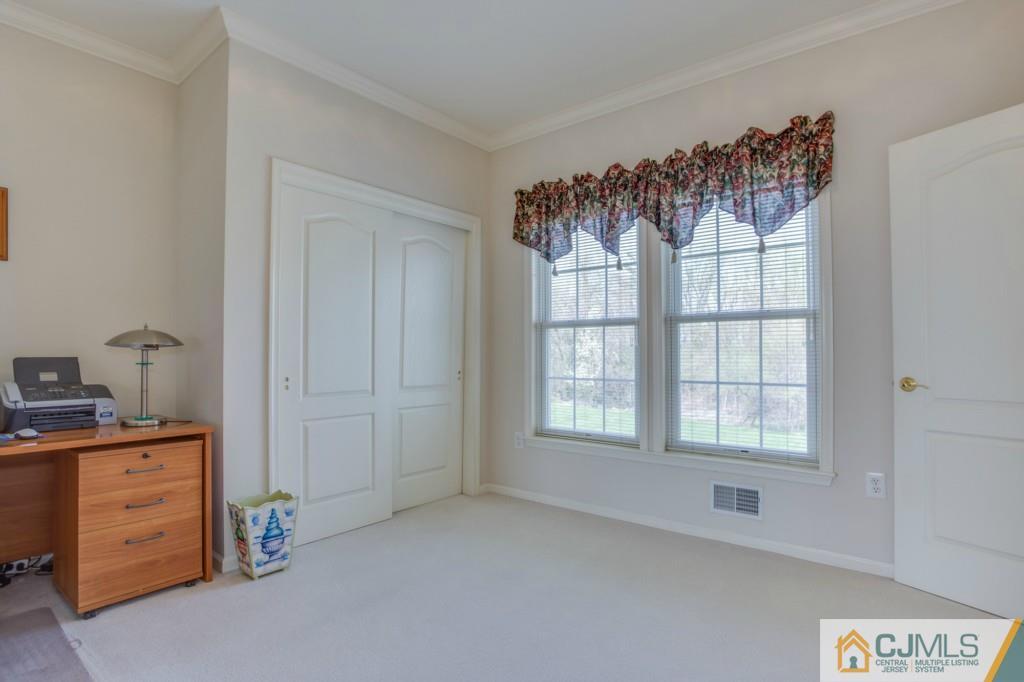 85 Sharon Road Robbinsville, NJ 08691 - Photo 21 of 25 a view of a bedroom with a window and a kitchen