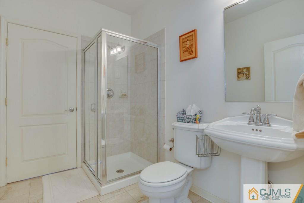 85 Sharon Road Robbinsville, NJ 08691 - Photo 22 of 25 a bathroom with a sink a toilet and shower
