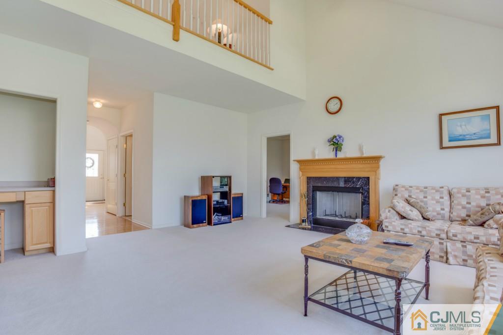 85 Sharon Road Robbinsville, NJ 08691 - Photo 23 of 25 a living room with furniture and a fireplace