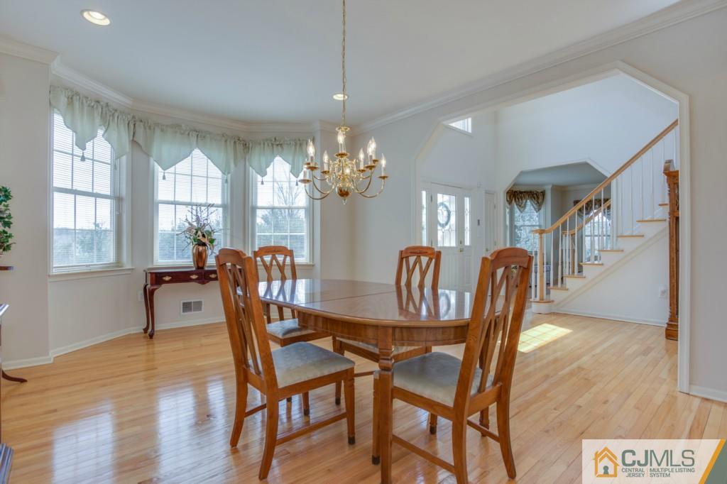85 Sharon Road Robbinsville, NJ 08691 - Photo 5 of 25 a view of a dining room with furniture and chandelier