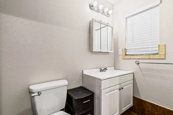 a kitchen with stainless steel appliances granite countertop a refrigerator stove and sink
