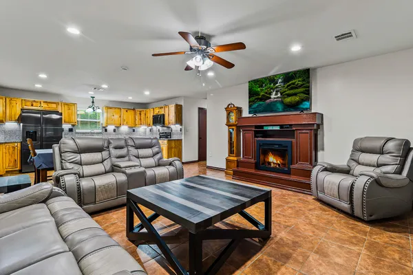 a living room with furniture and a fireplace