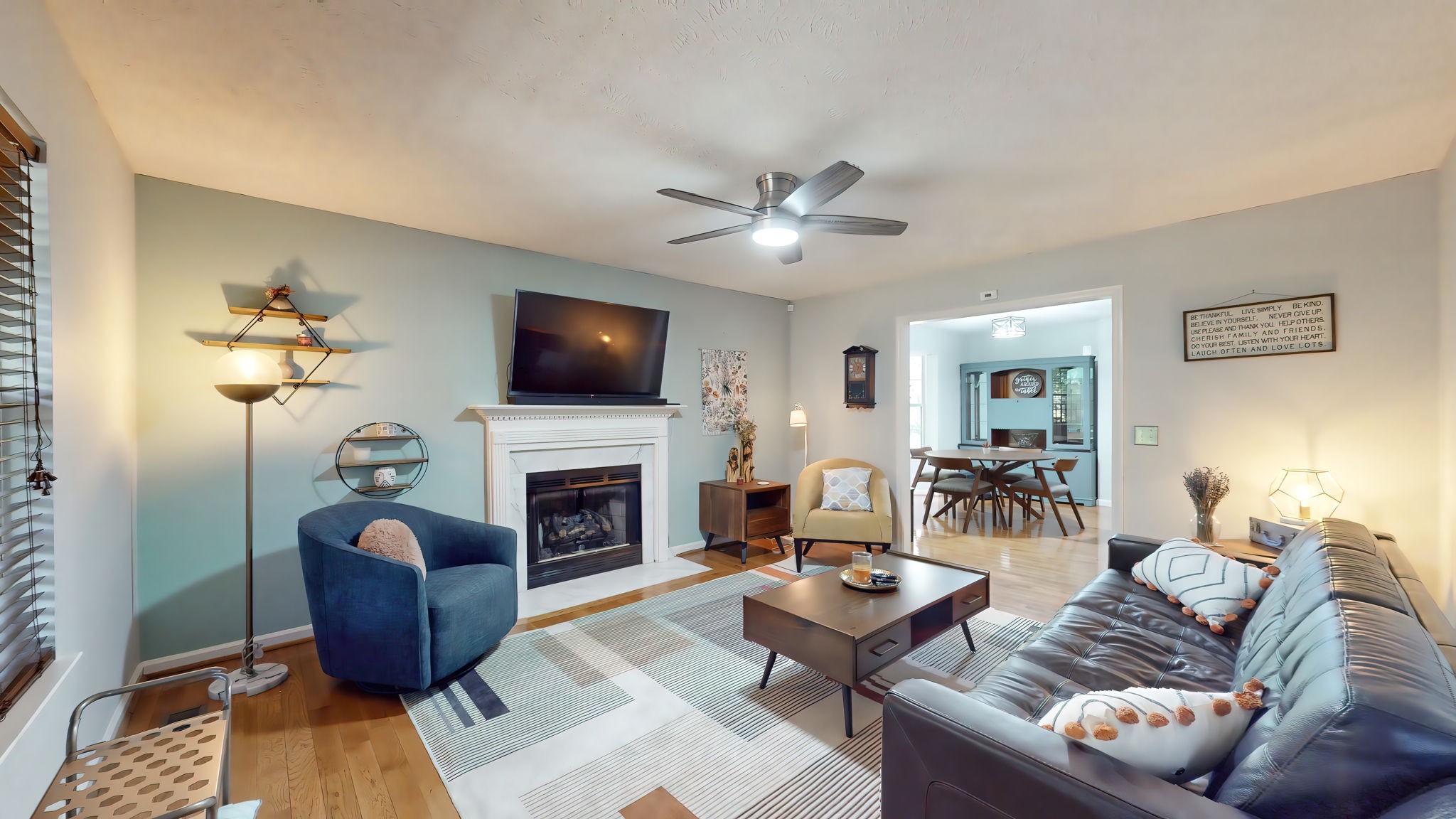 137 Gaskins Road Dickson, TN 37055 - Photo 14 of 58 a living room with furniture a fireplace and a flat screen tv
