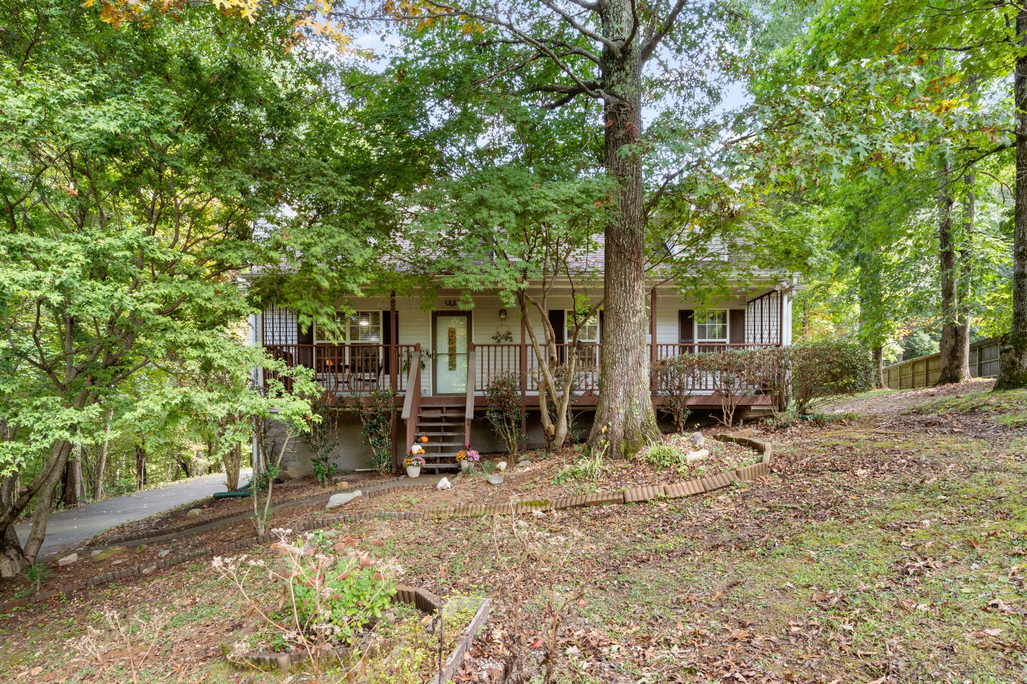 137 Gaskins Road Dickson, TN 37055 - Photo 2 of 58 a couple of table and chairs in backyard of house