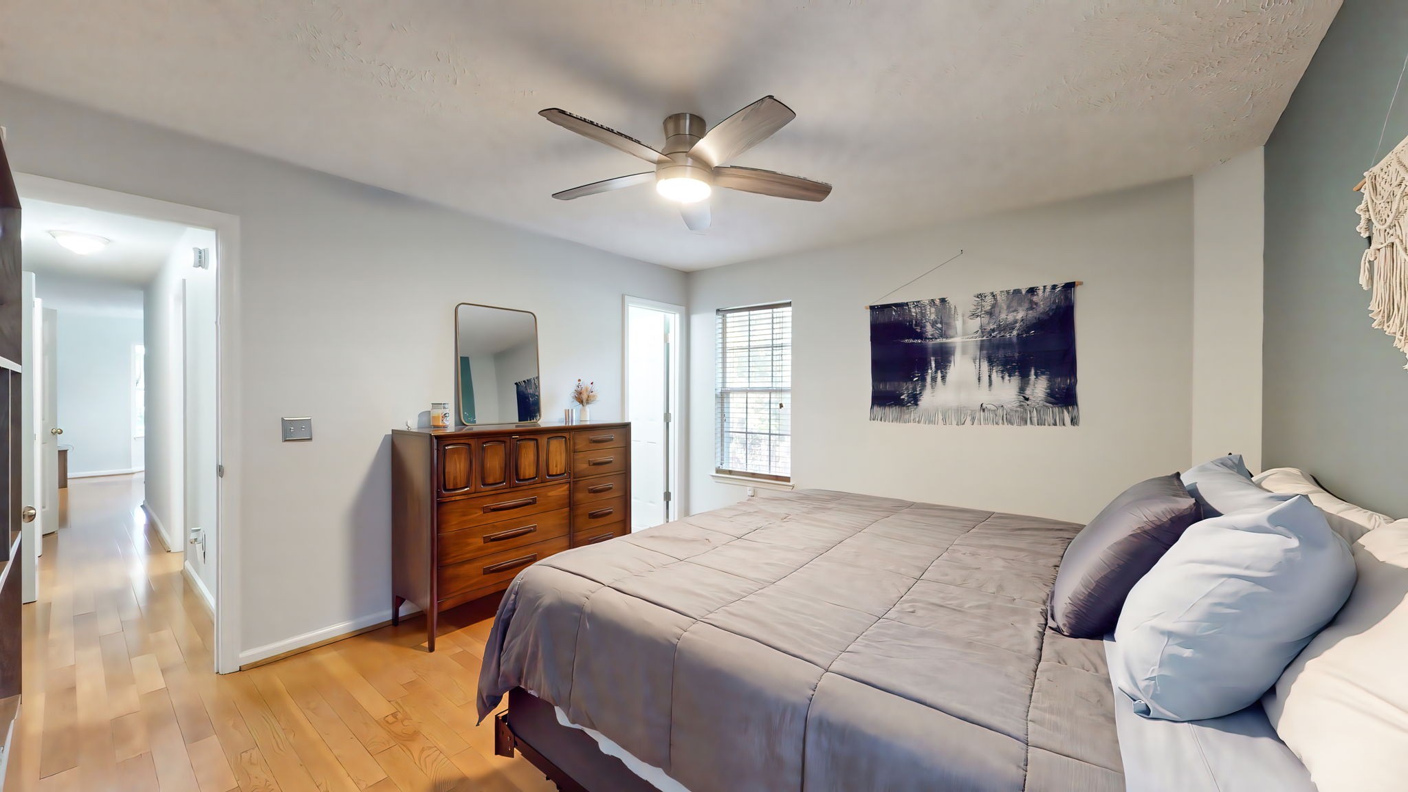 137 Gaskins Road Dickson, TN 37055 - Photo 31 of 58 a bed room with a bed and a chandelier