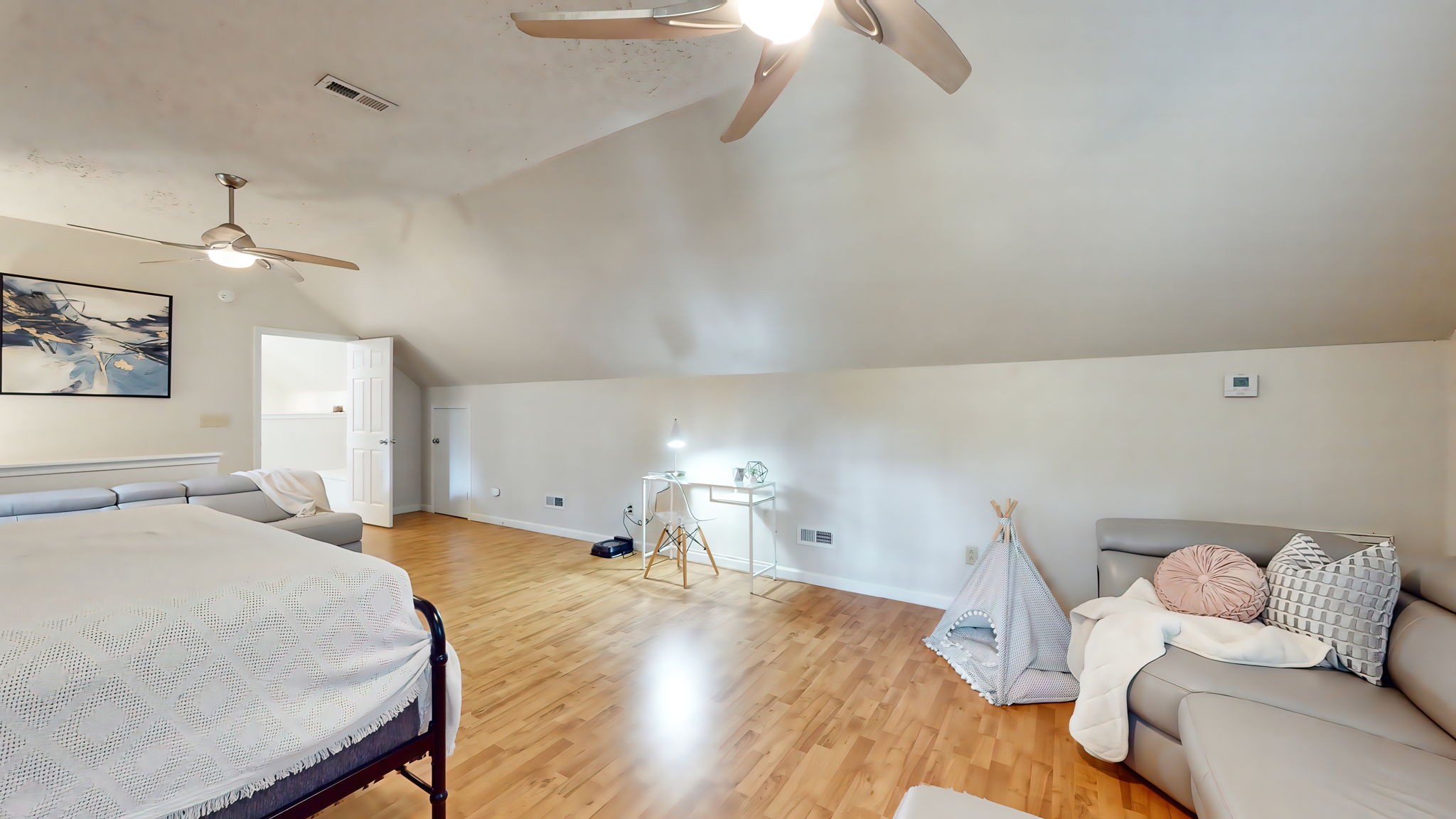 137 Gaskins Road Dickson, TN 37055 - Photo 46 of 58 a bed room with a bed and a chandelier