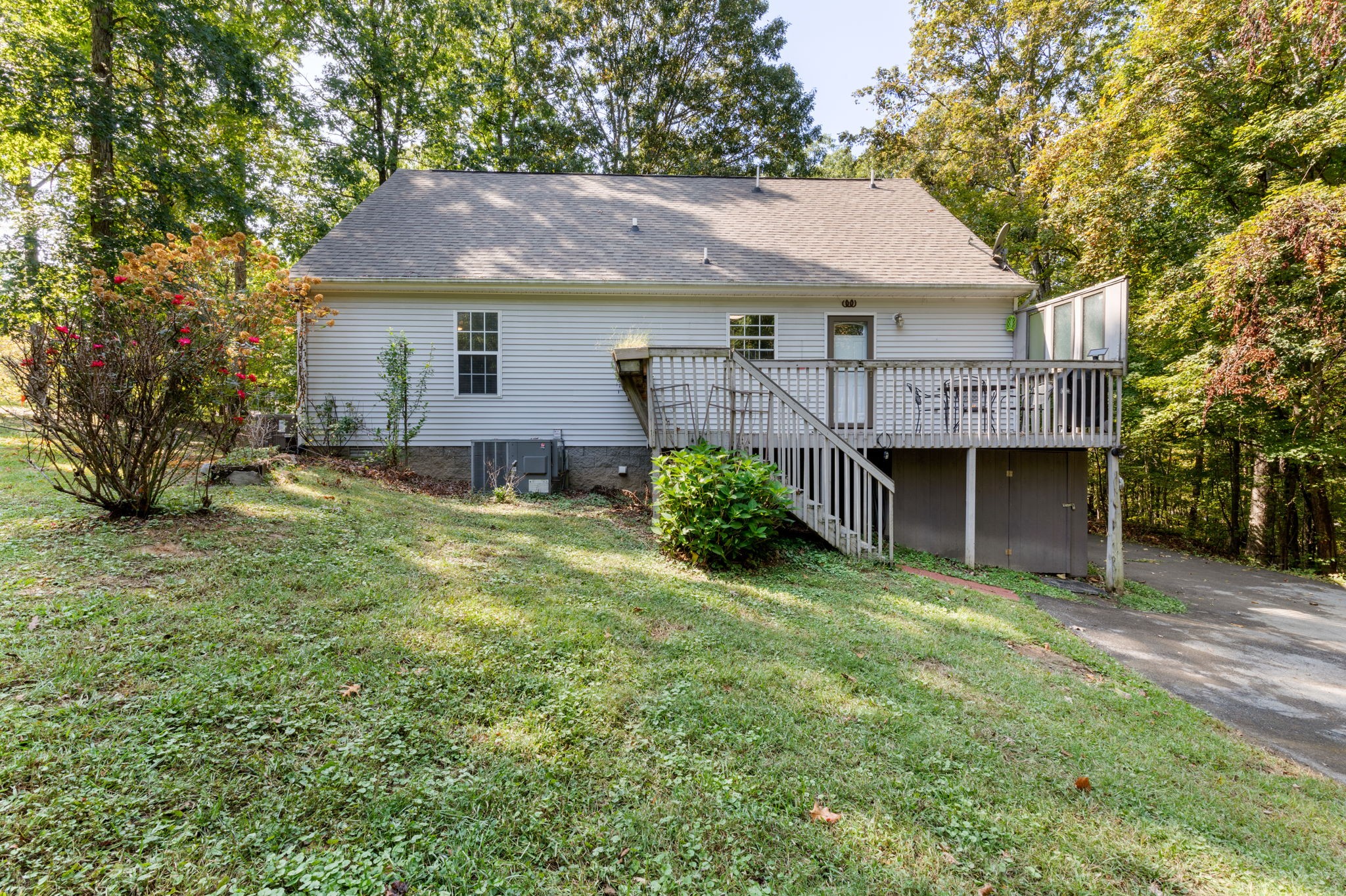 137 Gaskins Road Dickson, TN 37055 - Photo 10 of 58 a aerial view of a house next to a yard with potted plants and large trees