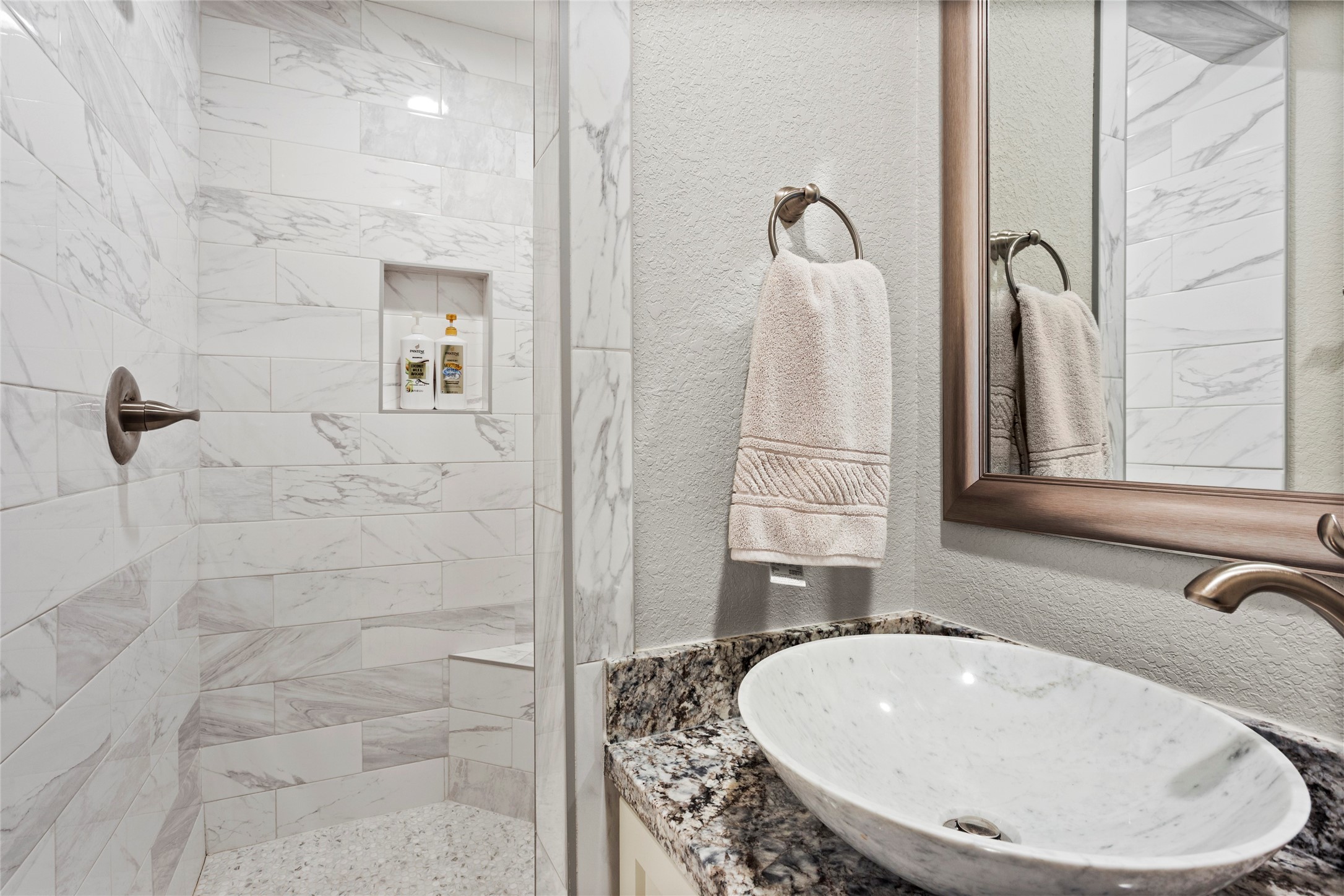 13800 West 6th Street Santa Fe, TX 77517 - Photo 21 of 35 a bathroom with a sink and a mirror