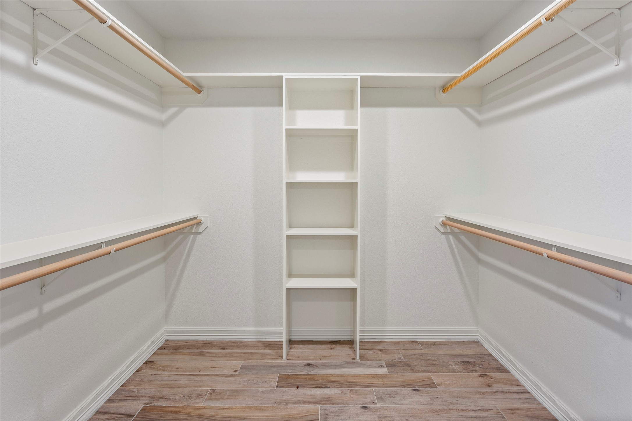13800 West 6th Street Santa Fe, TX 77517 - Photo 23 of 35 a view of an empty walk in closet