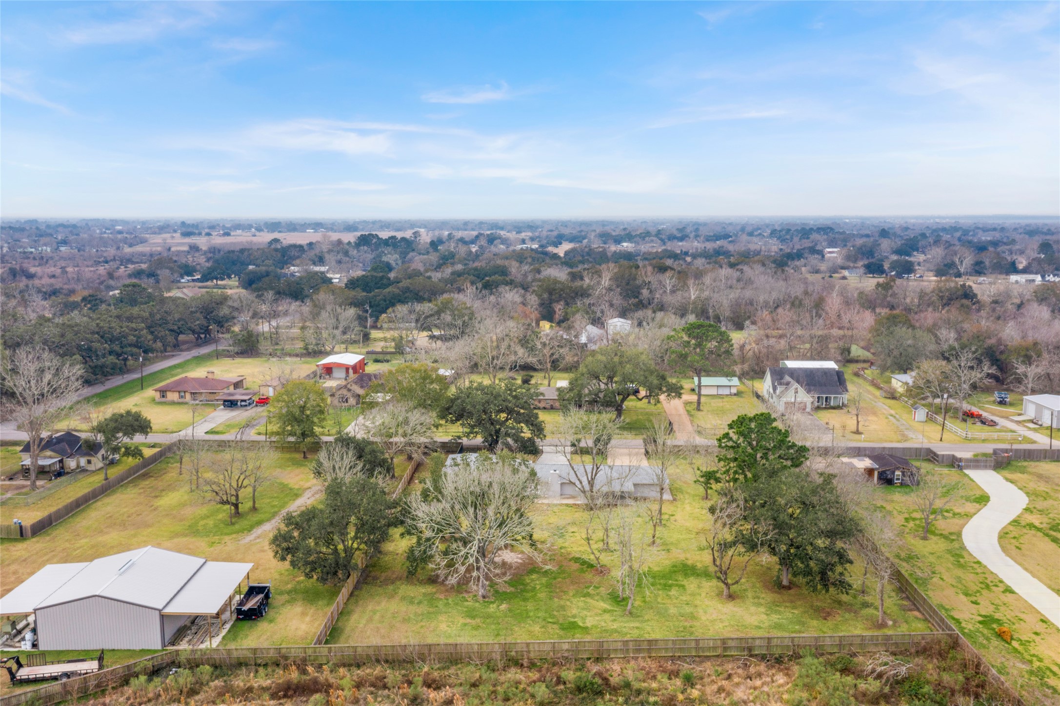 13800 West 6th Street Santa Fe, TX 77517 - Photo 32 of 35 an aerial view of residential houses with outdoor space