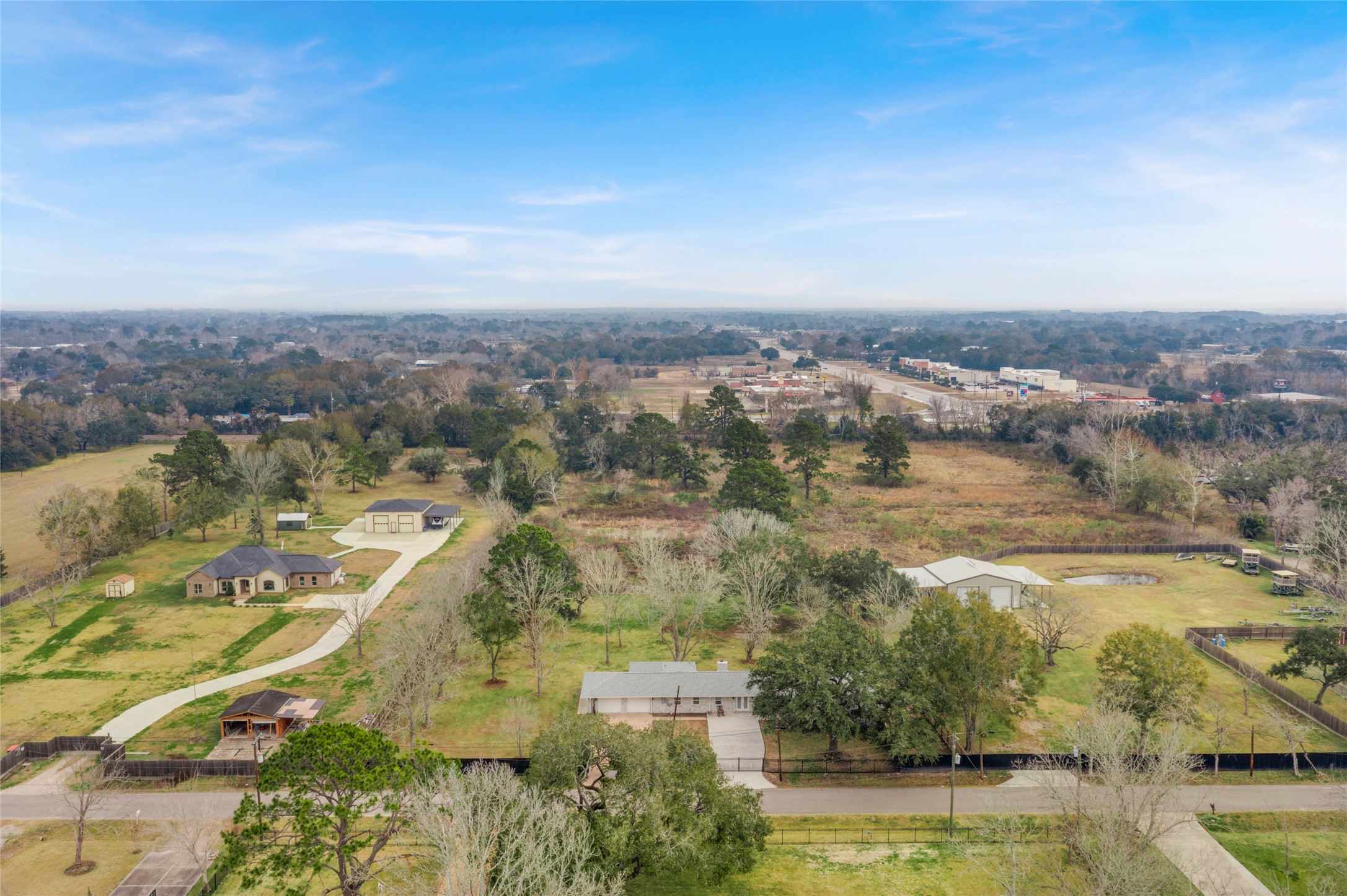 13800 West 6th Street Santa Fe, TX 77517 - Photo 6 of 35 an aerial view of residential building and lake view
