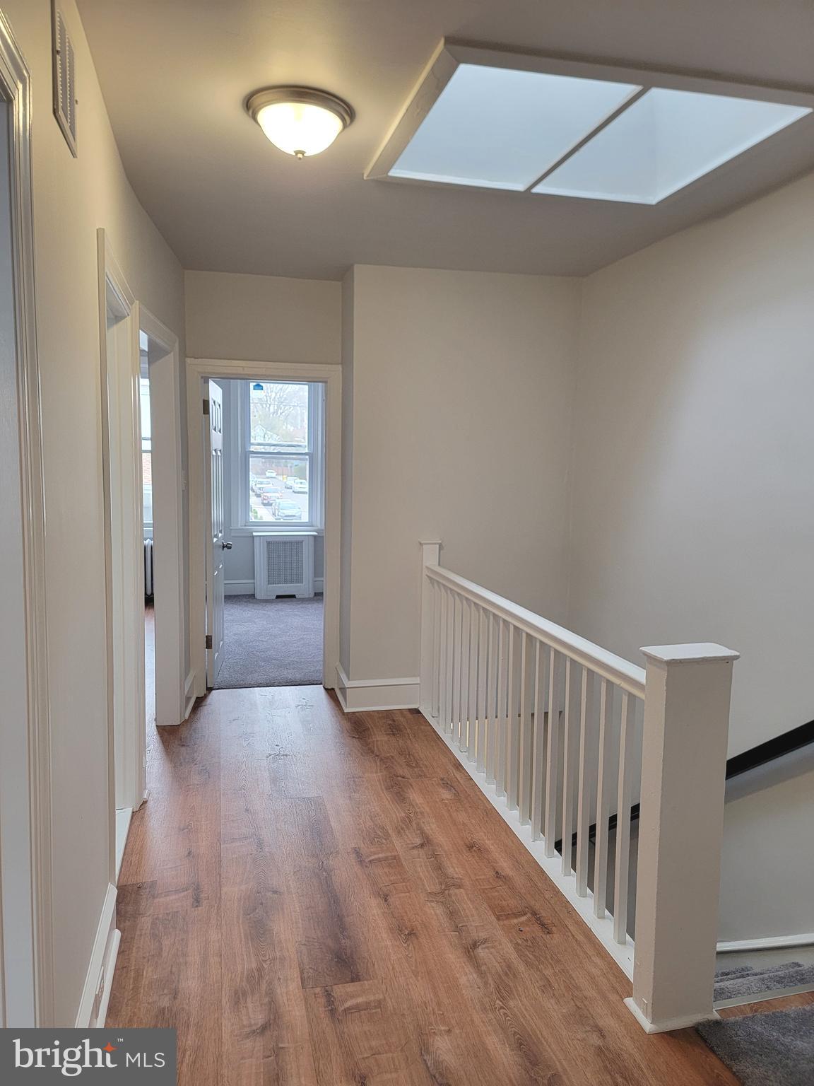 56 East Spring Avenue, Unit 2 Ardmore, PA 19003 - Photo 5 of 12 a view of an entryway with wooden floor