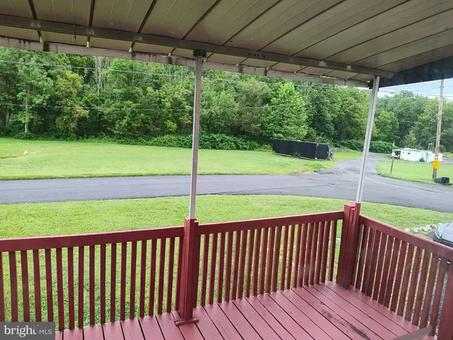 a view of a deck with a yard