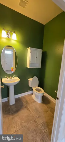 a bathroom with a toilet and a sink