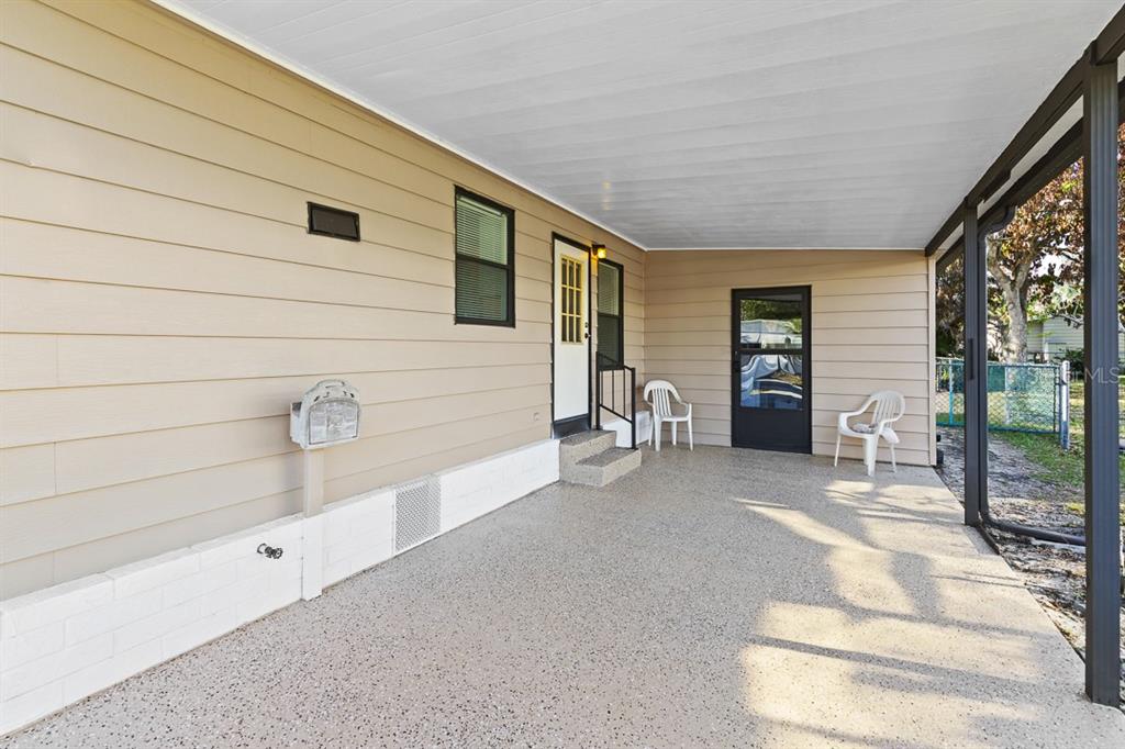 2828 Southwest Toronado Trail Stuart, FL 34997 - Photo 24 of 46 a view of a house with a patio