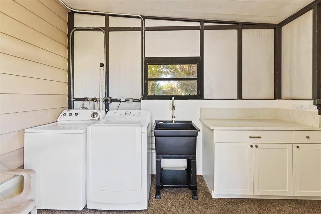 2828 Southwest Toronado Trail Stuart, FL 34997 - Photo 26 of 46 a bathroom with a sink and a mirror