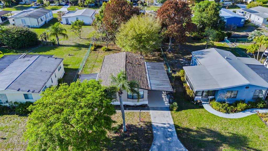 2828 Southwest Toronado Trail Stuart, FL 34997 - Photo 31 of 46 an aerial view of a house with garden space and street view