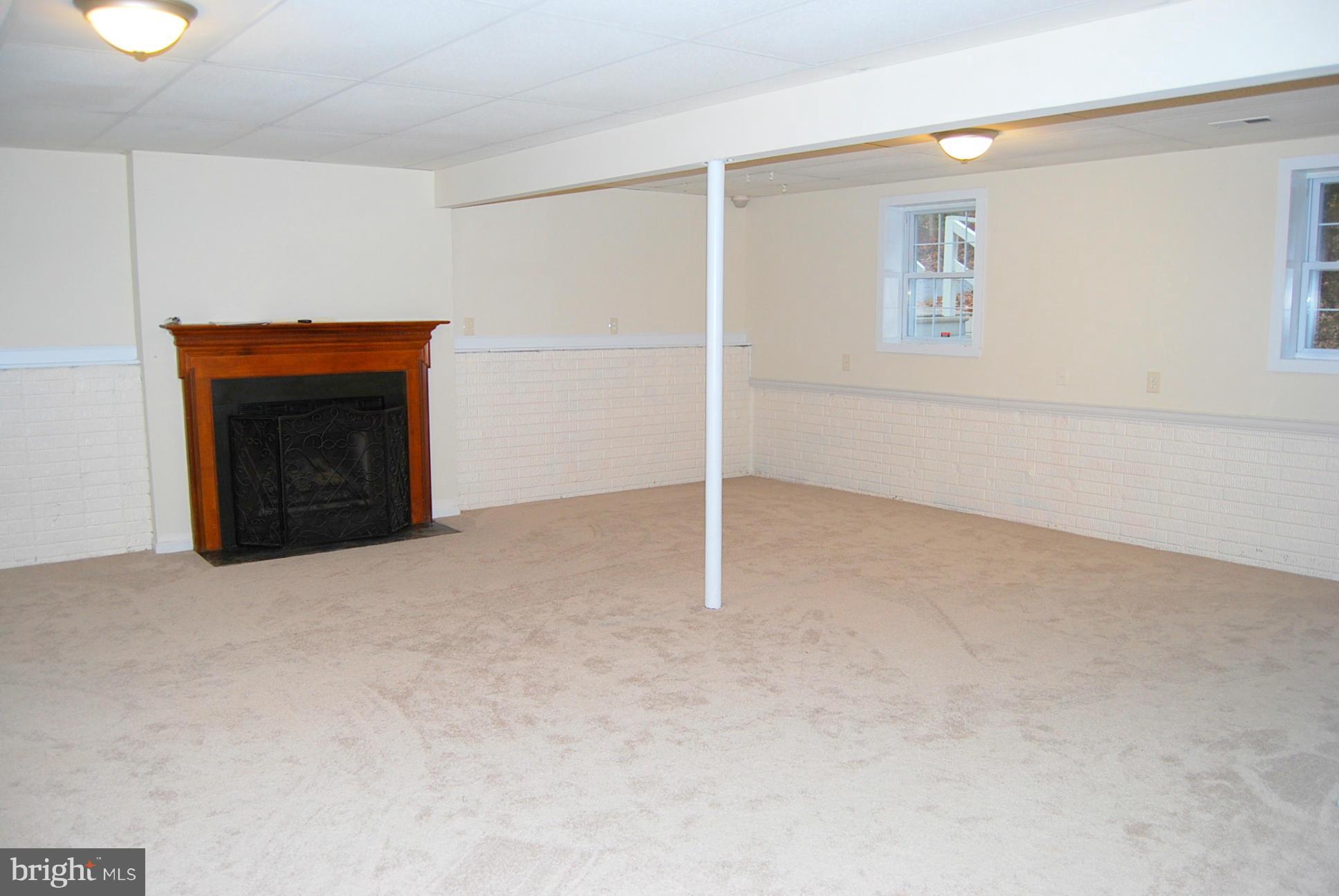 123 Potomac Run Road Fredericksburg, VA 22405 - Photo 14 of 22 Gas fireplace in the family room
