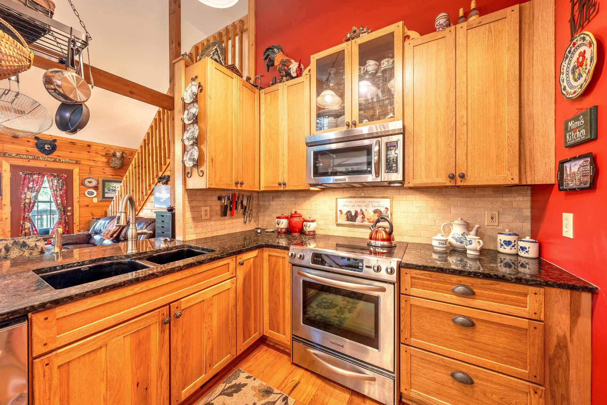 260 Deer Ridge Trail Ocoee, TN 37361 - Photo 49 of 72 a kitchen with stainless steel appliances a stove a sink and a microwave