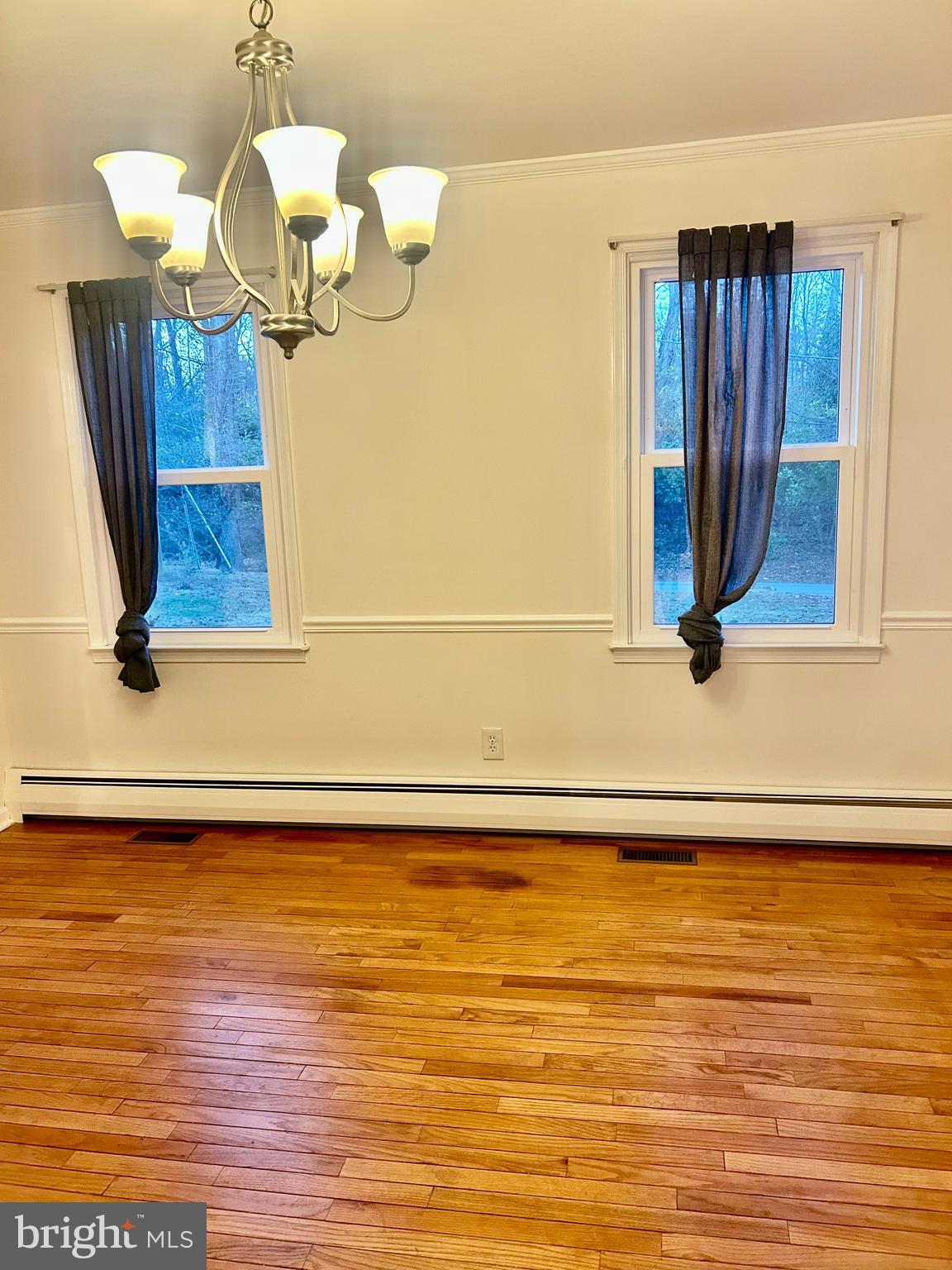 1007 Jones Road Conshohocken, PA 19428 - Photo 14 of 26 a view of a room with wooden floor and chandelier