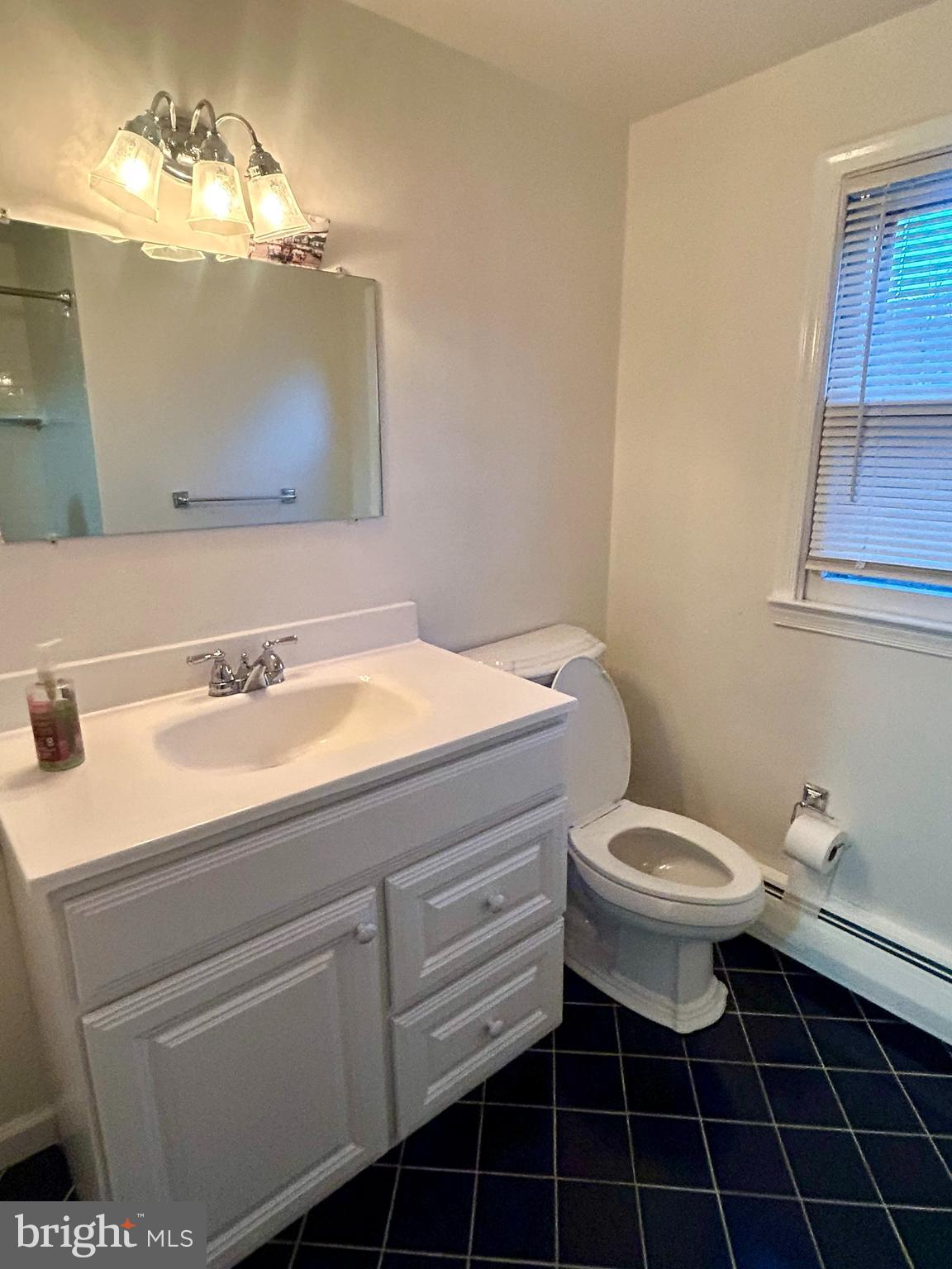 1007 Jones Road Conshohocken, PA 19428 - Photo 22 of 26 a bathroom with a sink toilet and vanity