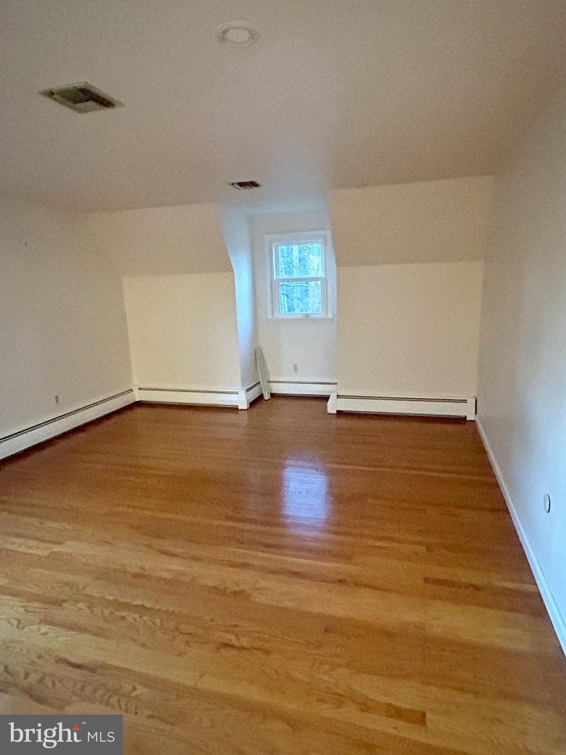 1007 Jones Road Conshohocken, PA 19428 - Photo 23 of 26 a view of an empty room with wooden floor