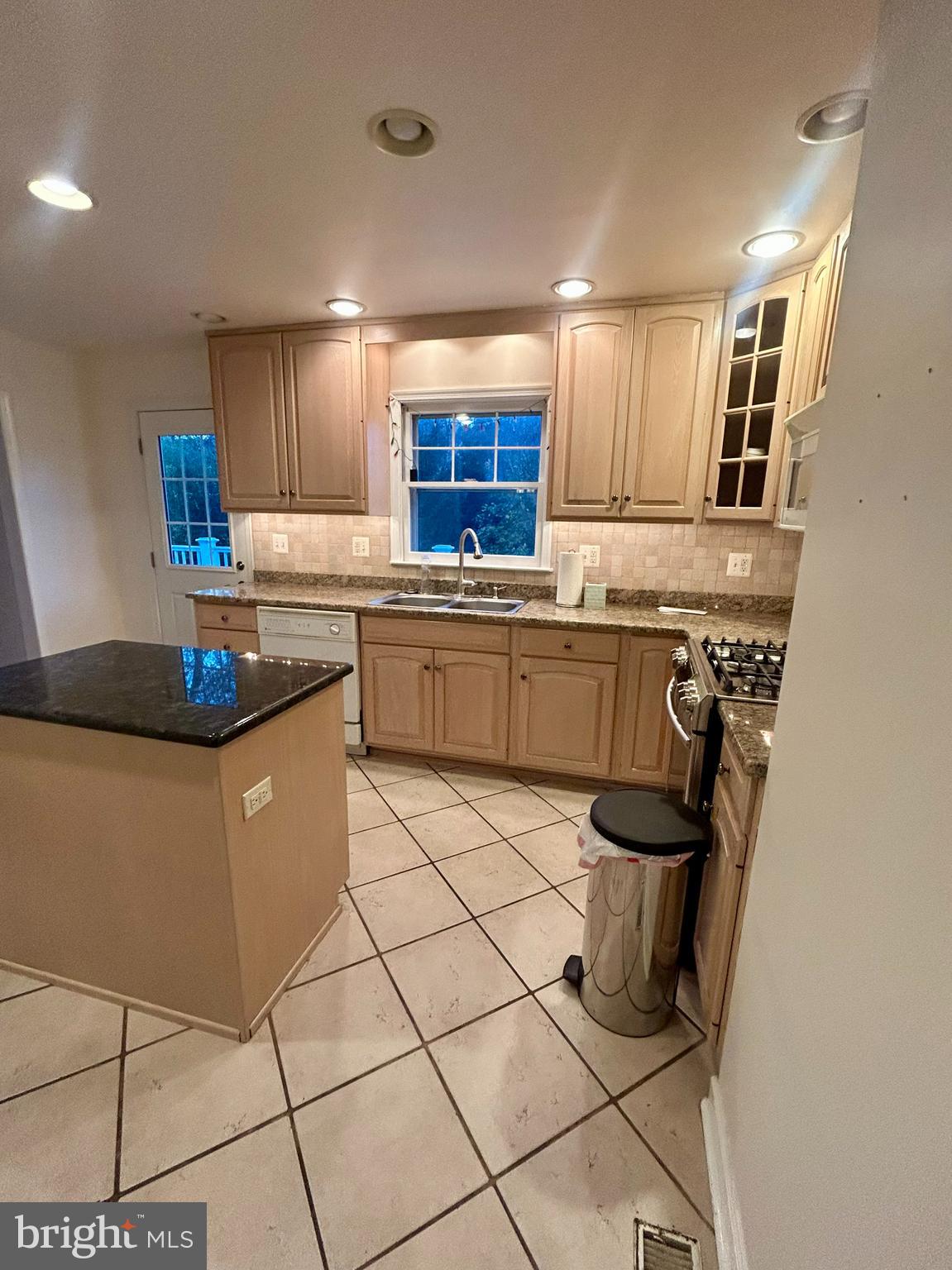 1007 Jones Road Conshohocken, PA 19428 - Photo 7 of 26 a kitchen with stainless steel appliances granite countertop a sink and a white cabinets