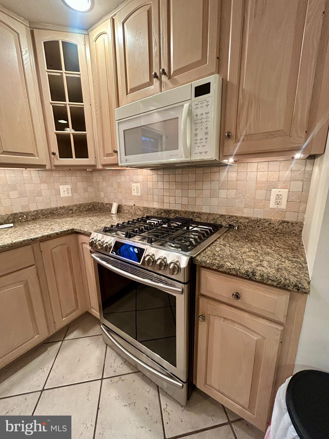 1007 Jones Road Conshohocken, PA 19428 - Photo 9 of 26 a stove top oven sitting inside of a kitchen