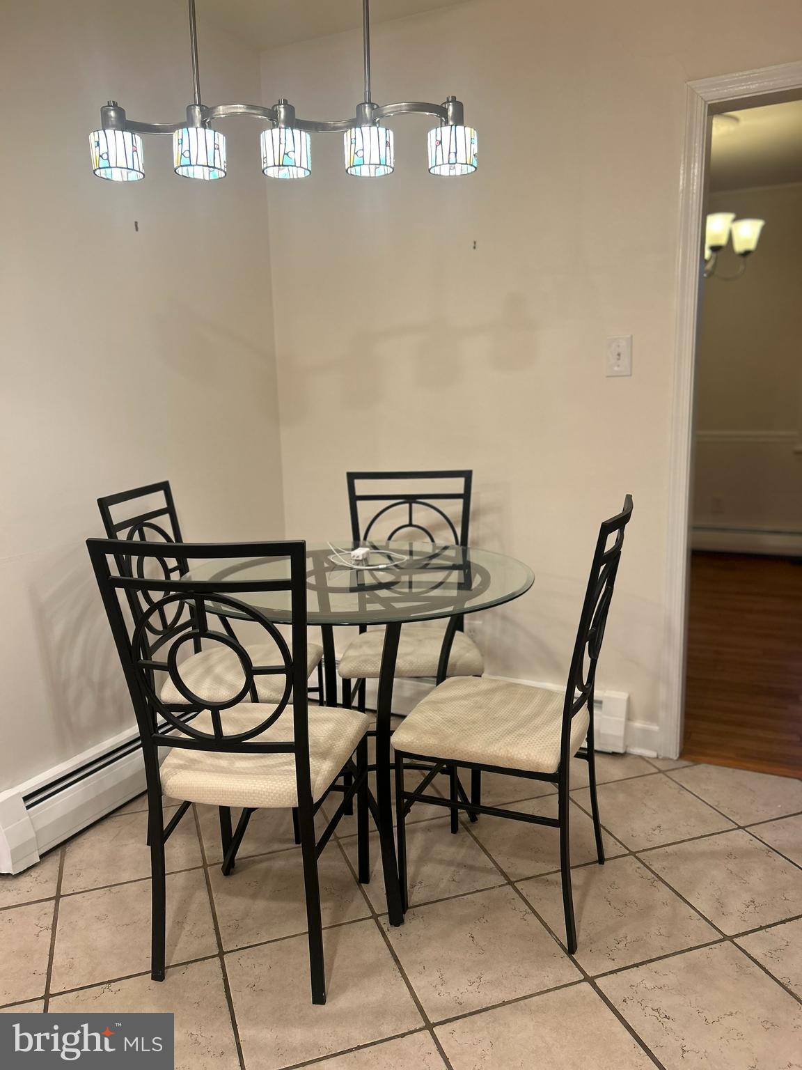 1007 Jones Road Conshohocken, PA 19428 - Photo 10 of 26 a view of a dining room with furniture and chandelier