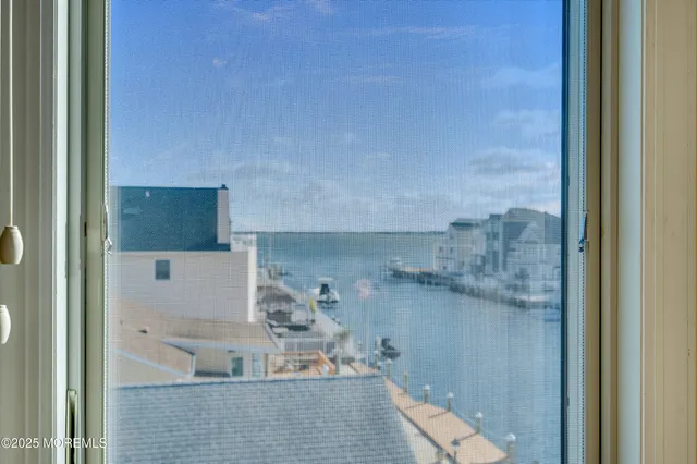 an aerial view of ocean and building