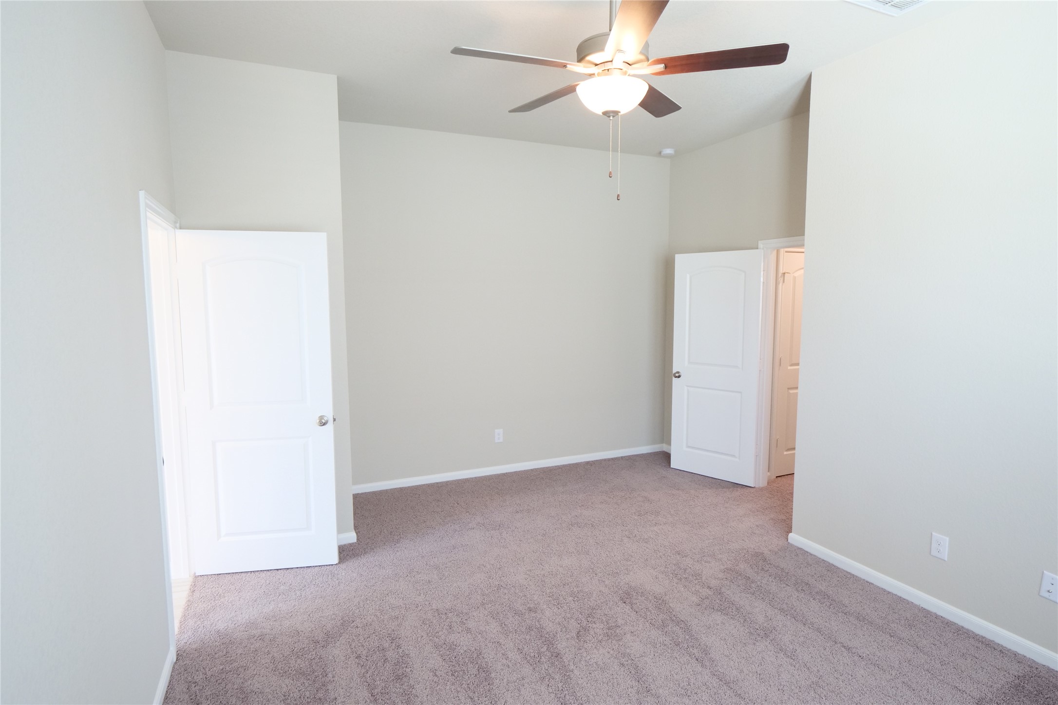 5110 Prairie Terrace Fulshear, TX 77441 - Photo 18 of 31 an empty room with a ceiling fan and a window