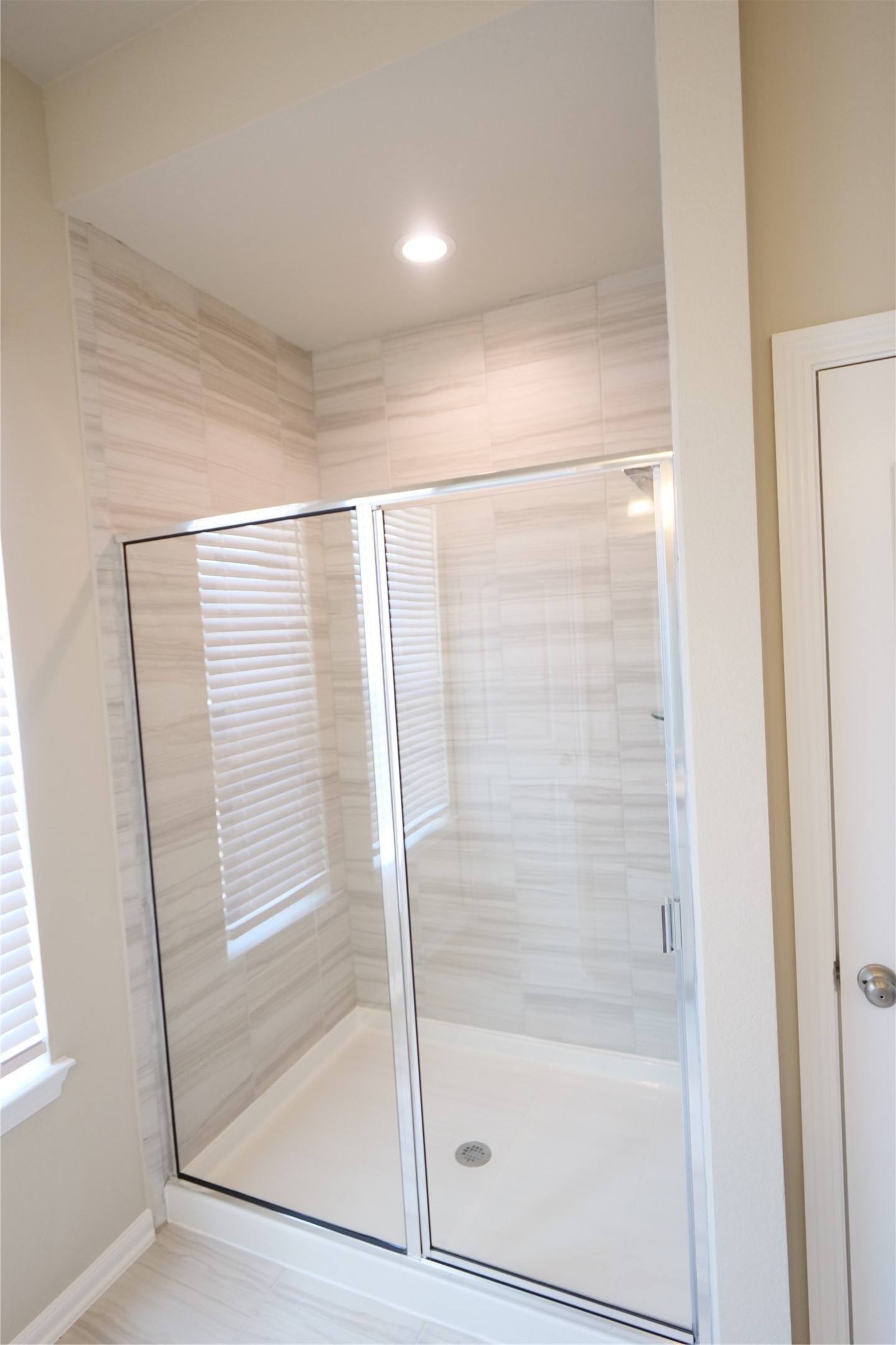 5110 Prairie Terrace Fulshear, TX 77441 - Photo 20 of 31 a bathroom with a glass shower door